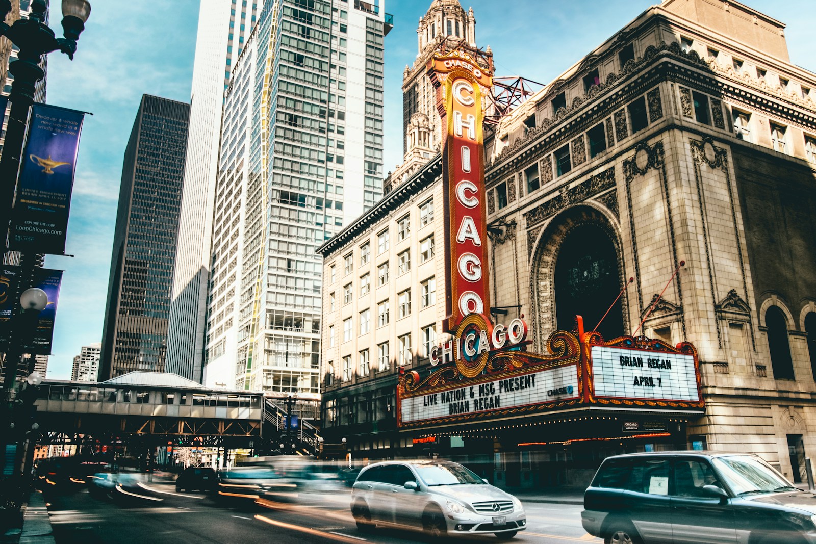 Temporary stock: historic theater facade among urban commercial buildings